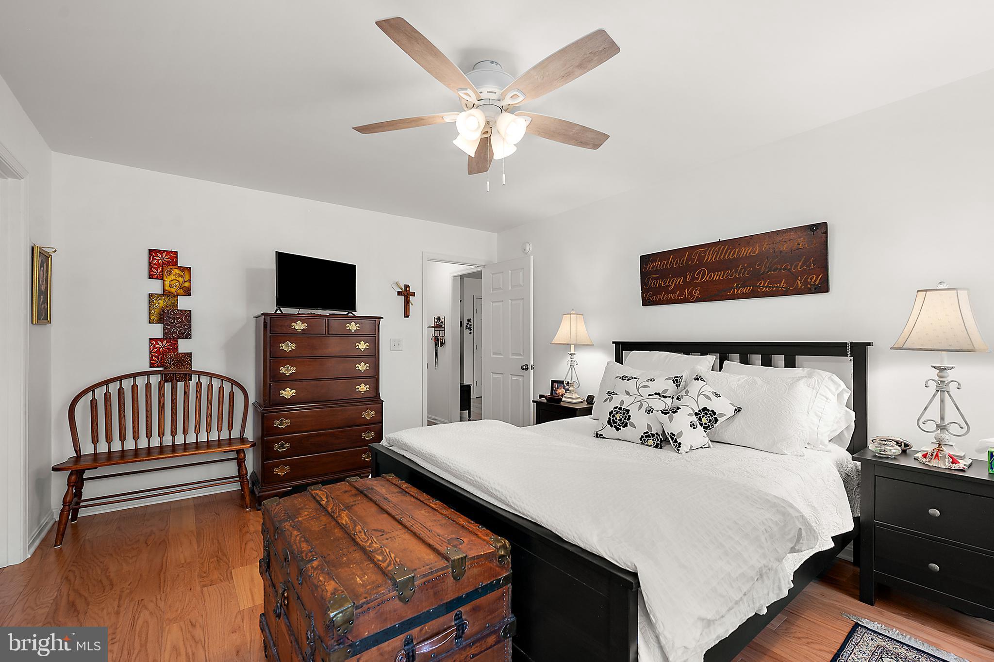 6098 Tarry Town Road Salisbury, MD 21801 - Photo 27 of 60 a bedroom with furniture and a flat screen tv