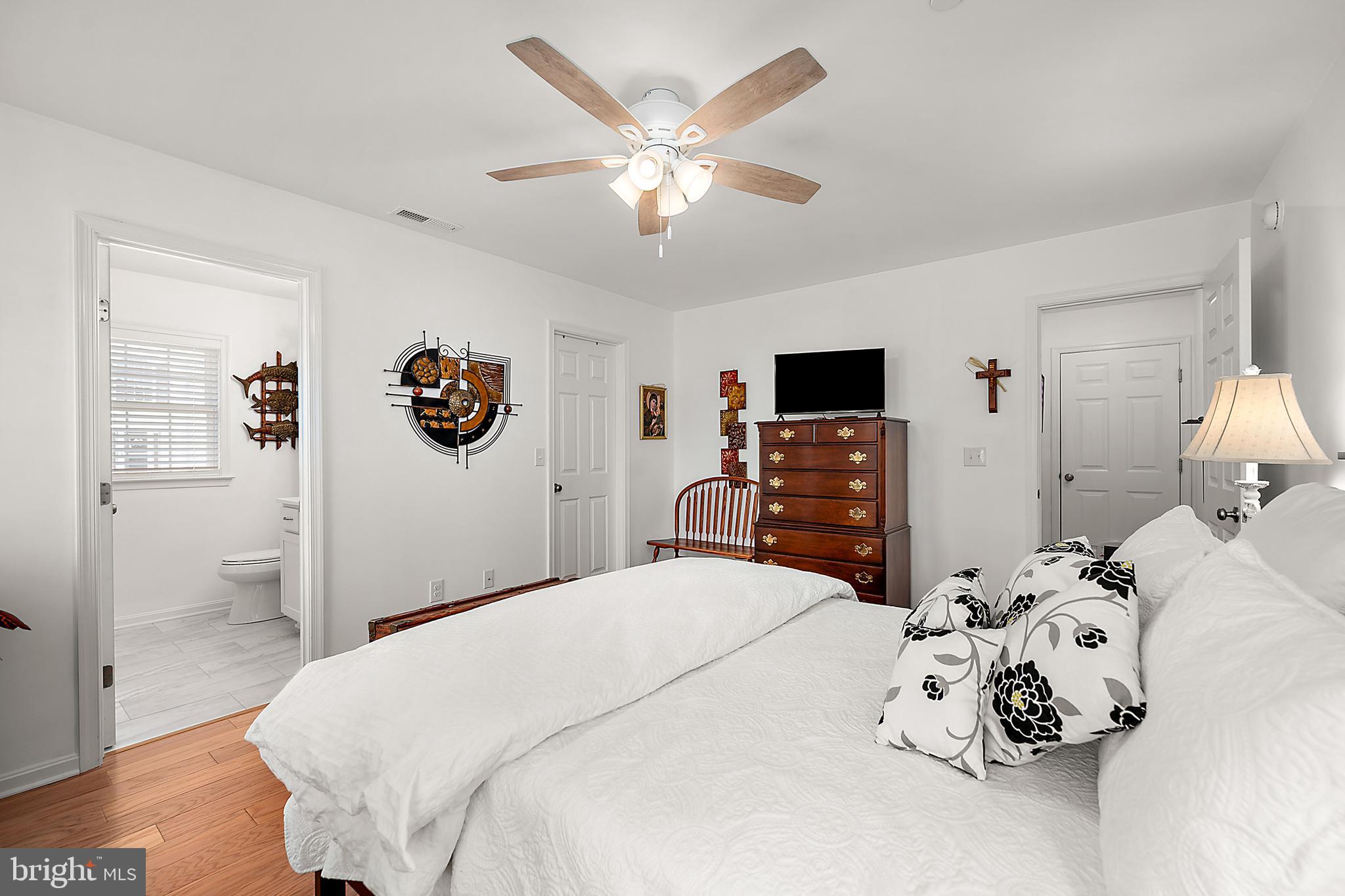 6098 Tarry Town Road Salisbury, MD 21801 - Photo 28 of 60 a bedroom with a bed and a flat tv screen on dresser