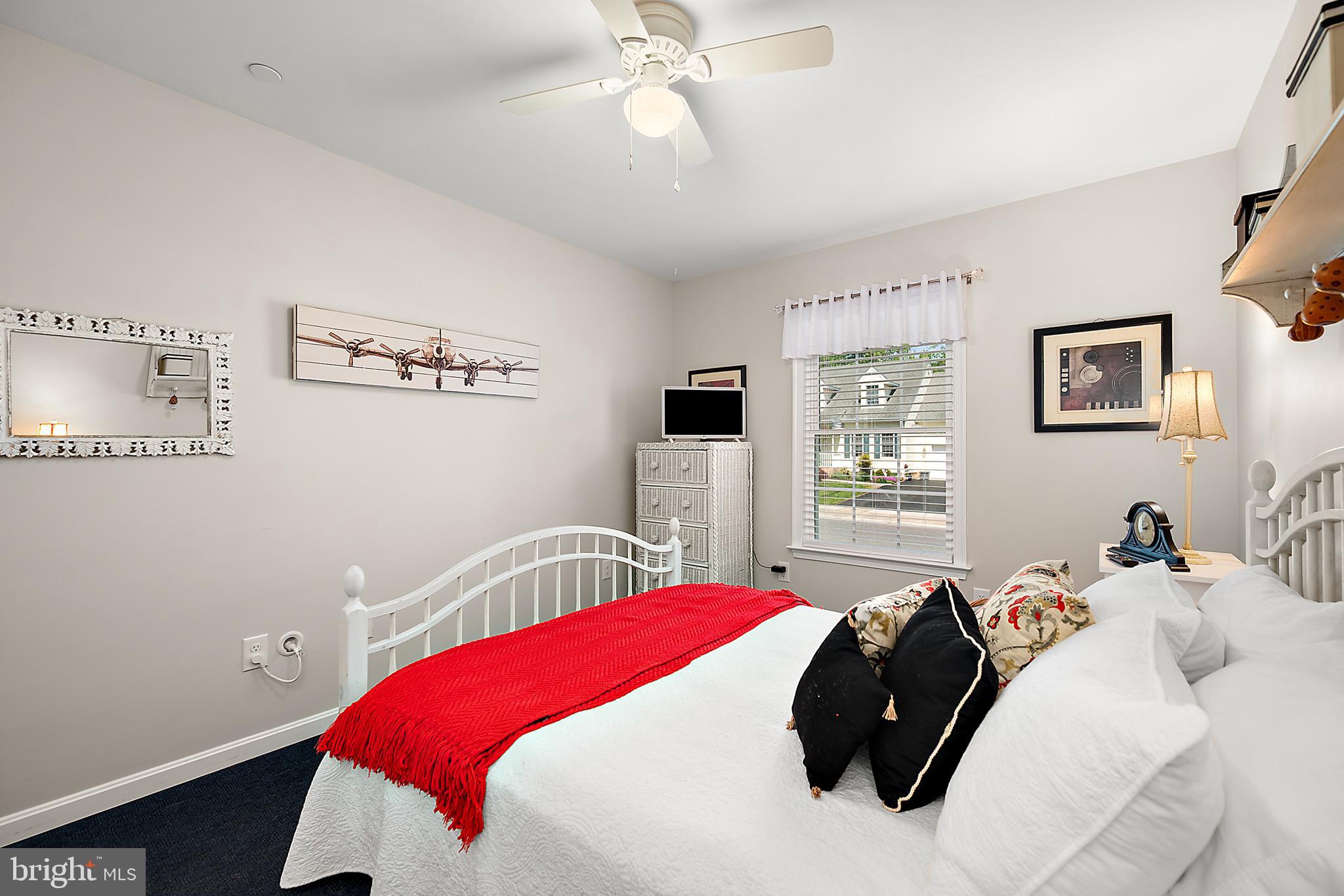 6098 Tarry Town Road Salisbury, MD 21801 - Photo 31 of 60 a bedroom with a bed and a chandelier