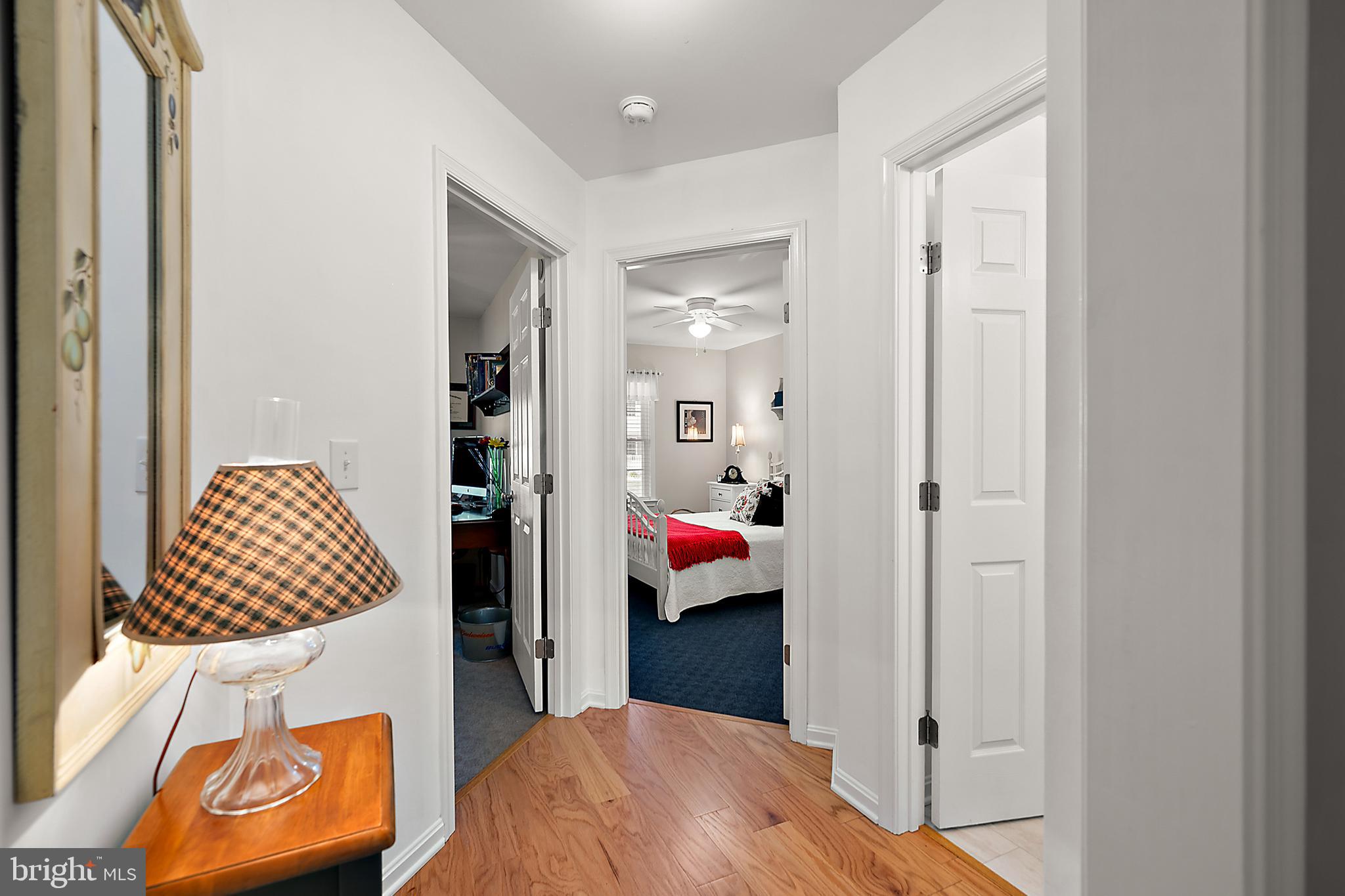 6098 Tarry Town Road Salisbury, MD 21801 - Photo 36 of 60 a bedroom with a bed and a painting on the wall