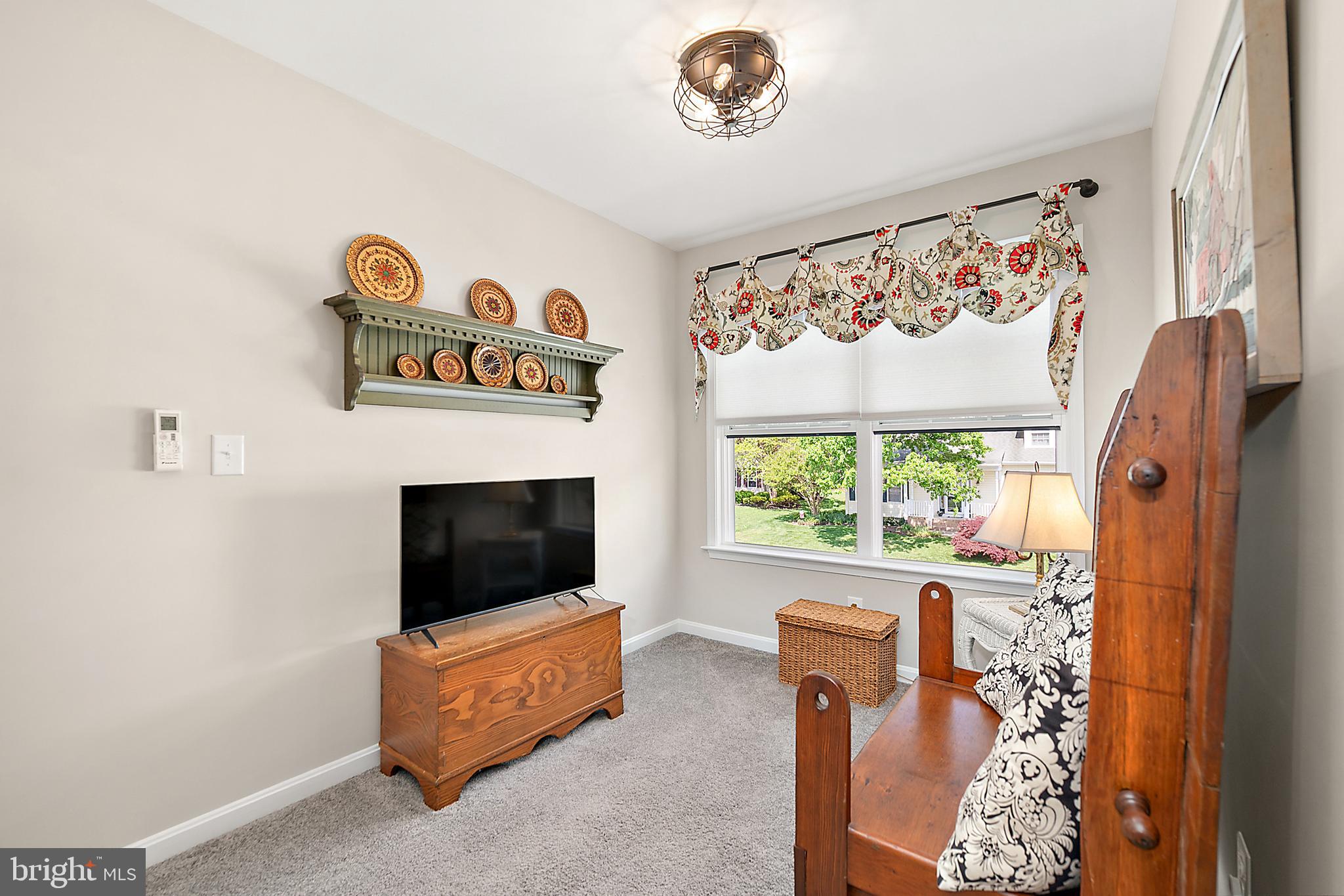 6098 Tarry Town Road Salisbury, MD 21801 - Photo 39 of 60 a living room with furniture and a flat screen tv