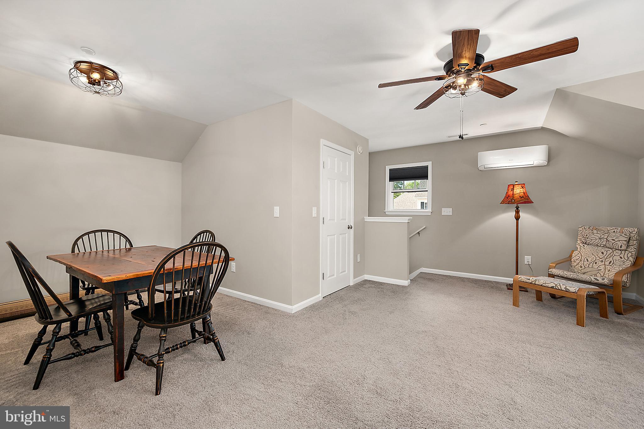6098 Tarry Town Road Salisbury, MD 21801 - Photo 40 of 60 a view of a workspace with furniture and a ceiling fan