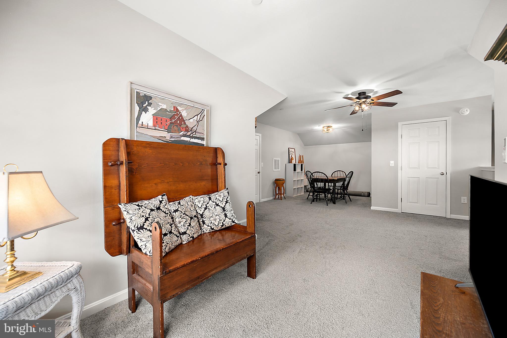 6098 Tarry Town Road Salisbury, MD 21801 - Photo 43 of 60 a bed room with furniture and a flat screen tv