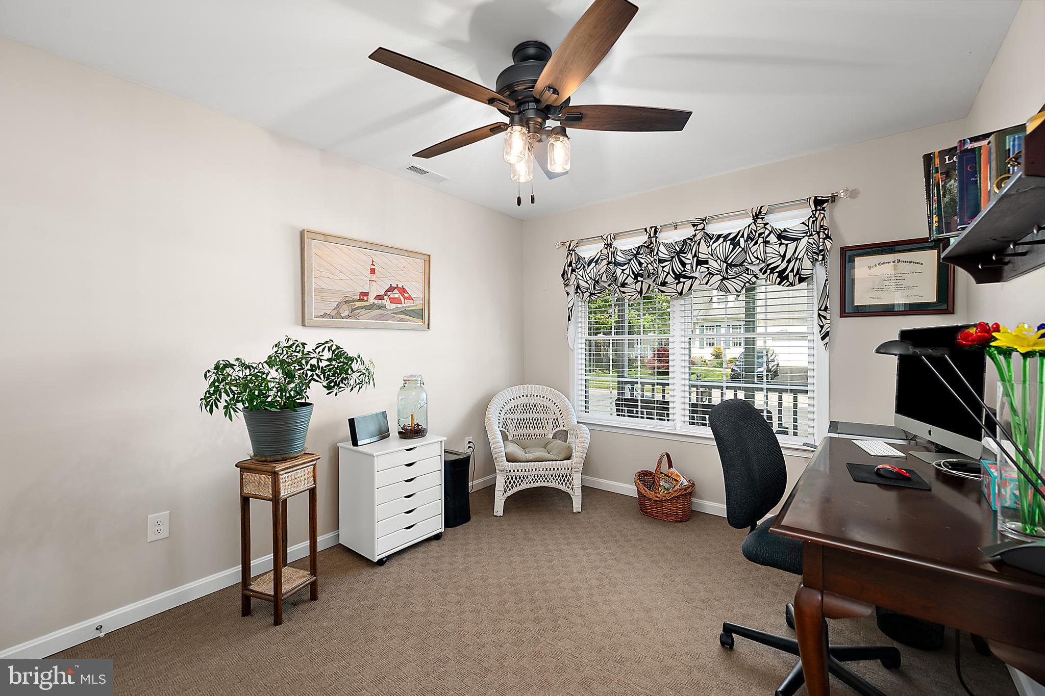 6098 Tarry Town Road Salisbury, MD 21801 - Photo 45 of 60 a view of a workspace with furniture and a window