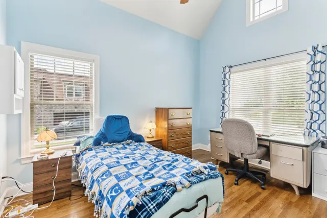 a bedroom with a bed and a chair