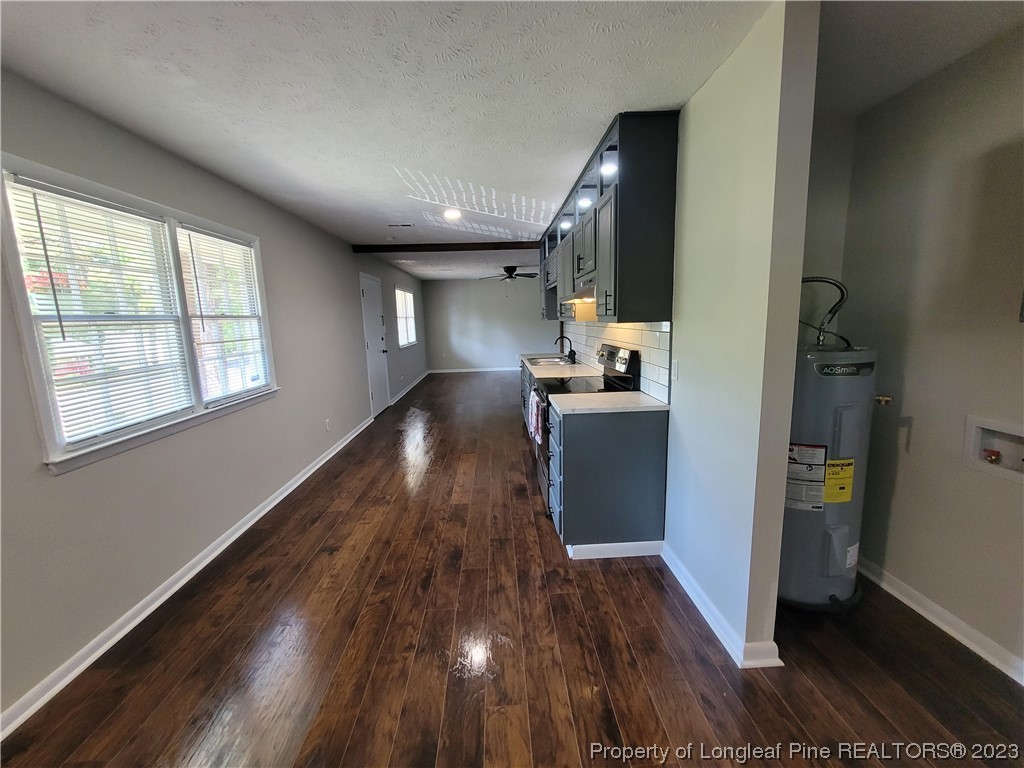 6442 Green Meadow Road Fayetteville, NC 28304 - Photo 16 of 48 a view of a kitchen from the hallway