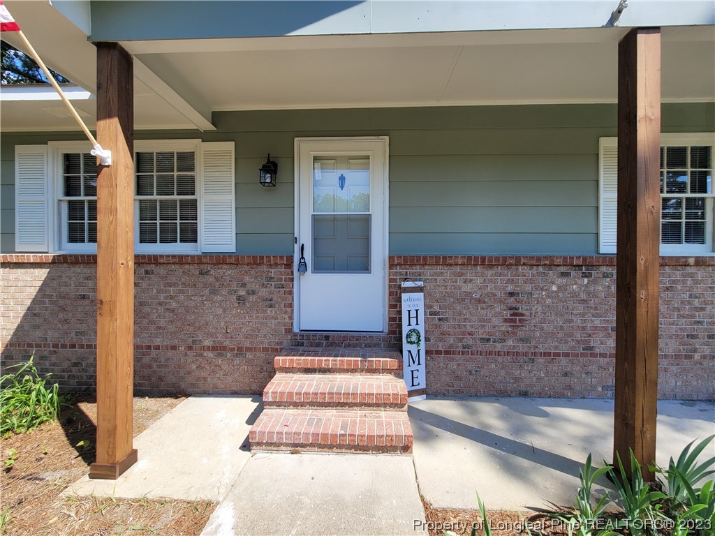 6442 Green Meadow Road Fayetteville, NC 28304 - Photo 3 of 48 a front view of a house