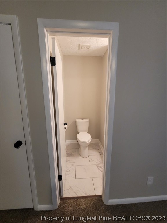 6442 Green Meadow Road Fayetteville, NC 28304 - Photo 32 of 48 a bathroom with a toilet