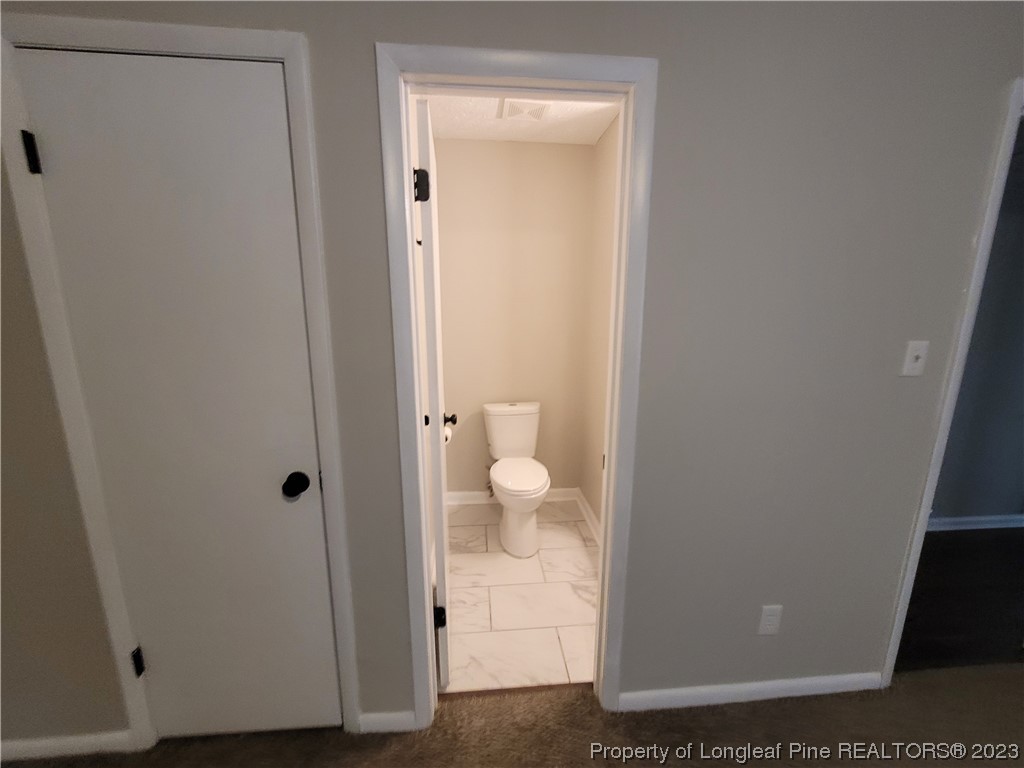 6442 Green Meadow Road Fayetteville, NC 28304 - Photo 33 of 48 a view of bathroom with a toilet