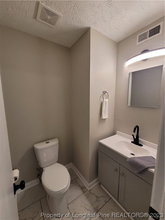 6442 Green Meadow Road Fayetteville, NC 28304 - Photo 34 of 48 a bathroom with a toilet sink and mirror