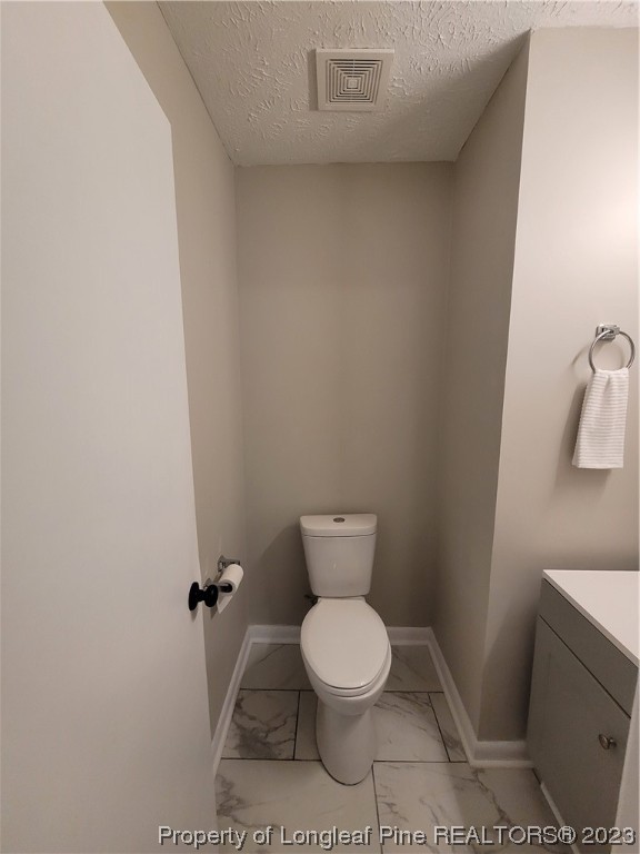6442 Green Meadow Road Fayetteville, NC 28304 - Photo 35 of 48 a white toilet sitting next to a white sink