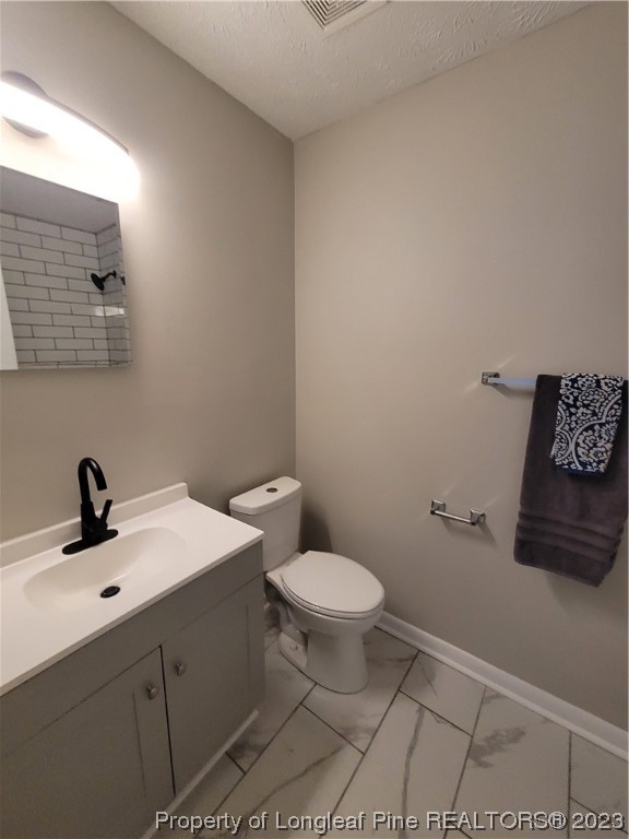 6442 Green Meadow Road Fayetteville, NC 28304 - Photo 40 of 48 a bathroom with a sink a toilet and mirror