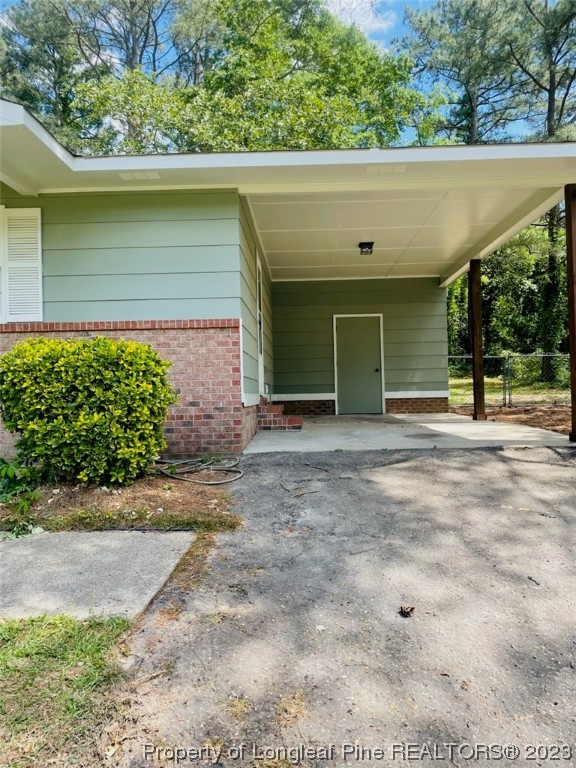 6442 Green Meadow Road Fayetteville, NC 28304 - Photo 46 of 48 a view of a house with a yard