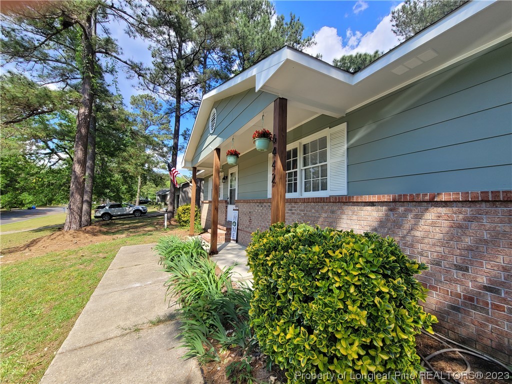 6442 Green Meadow Road Fayetteville, NC 28304 - Photo 5 of 48 a front view of a house with garden