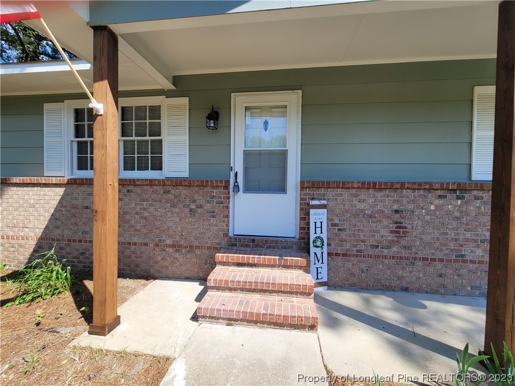 6442 Green Meadow Road Fayetteville, NC 28304 - Photo 7 of 48 a front view of a house