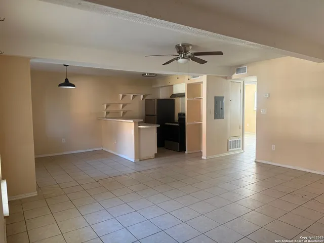 a view of a kitchen with a sink and cabinet