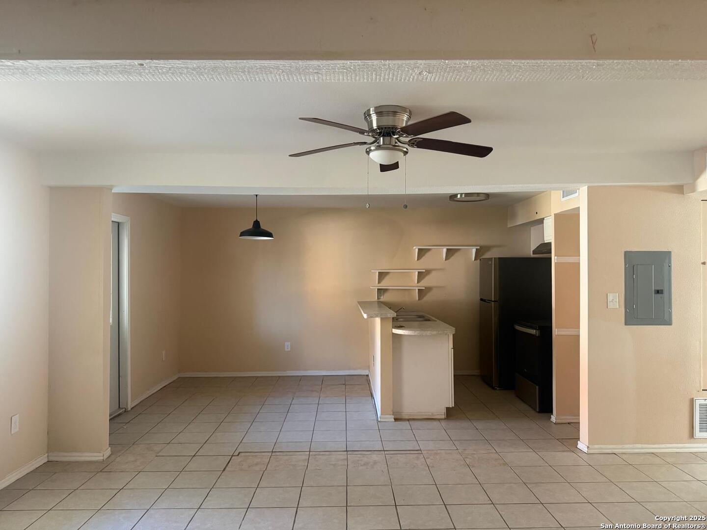 3718 Pleasanton Road, Unit 2103 San Antonio, TX 78221 - Photo 3 of 7 a view of a kitchen with a sink and a refrigerator