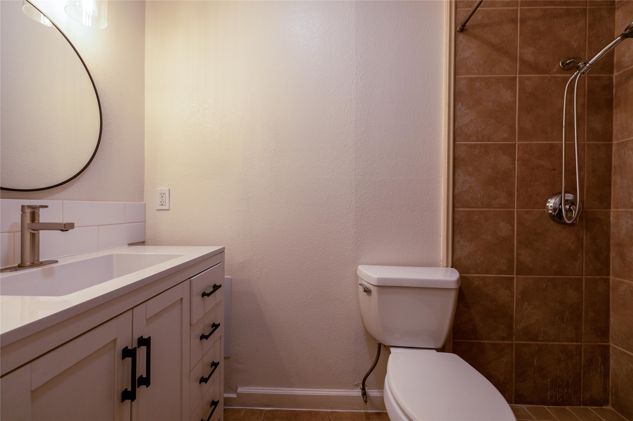 4304 Scottsdale Road Austin, TX 78721 - Photo 11 of 21 Bathroom featuring vanity and a shower stall