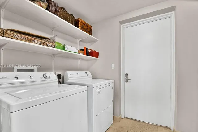 a utility room with dryer and washer