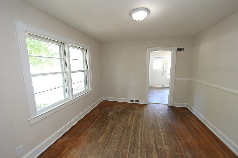 This well-lit room off the kitchen can serve as a formal living room or office/study. Flex Space