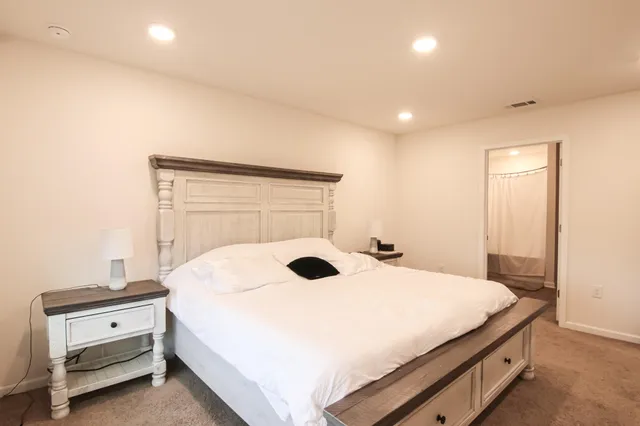 a bathroom with a double vanity sink mirror and double