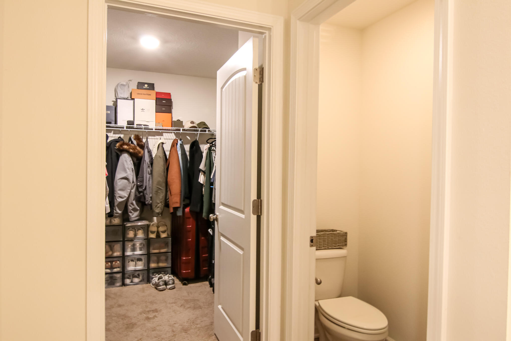 808 Moorhen Way Crestview, FL 32539 - Photo 15 of 47 a view of walk in closet with clothes and shoes