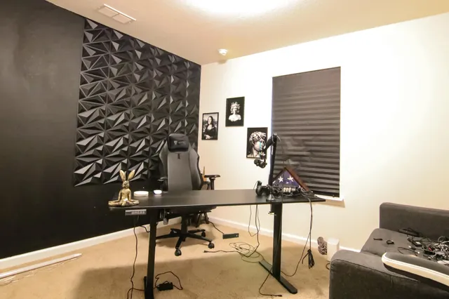 a bedroom with a bed and a potted plant