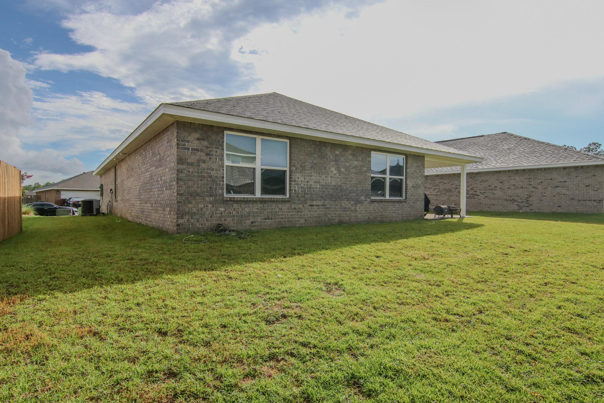 808 Moorhen Way Crestview, FL 32539 - Photo 30 of 47 a backyard of a house with lots of green space
