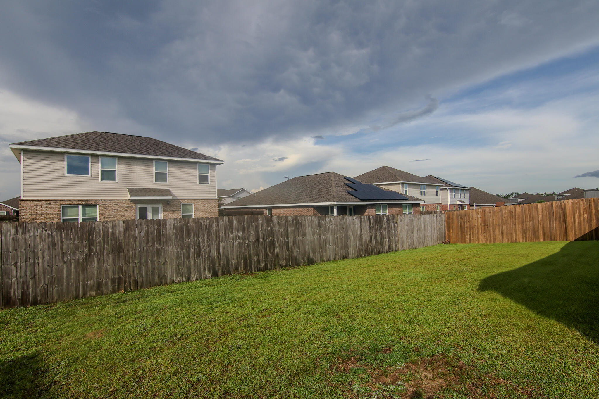 808 Moorhen Way Crestview, FL 32539 - Photo 31 of 47 a view of a yard with wooden fence
