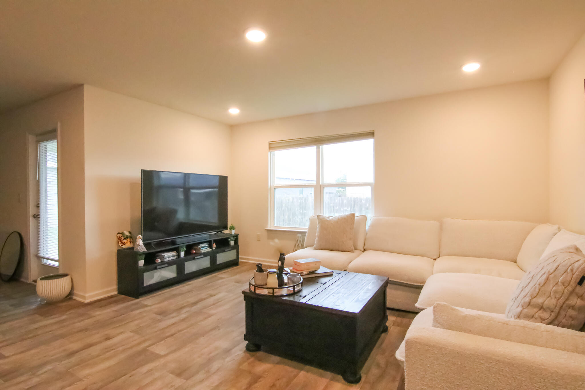 808 Moorhen Way Crestview, FL 32539 - Photo 44 of 47 a living room with furniture and a flat screen tv