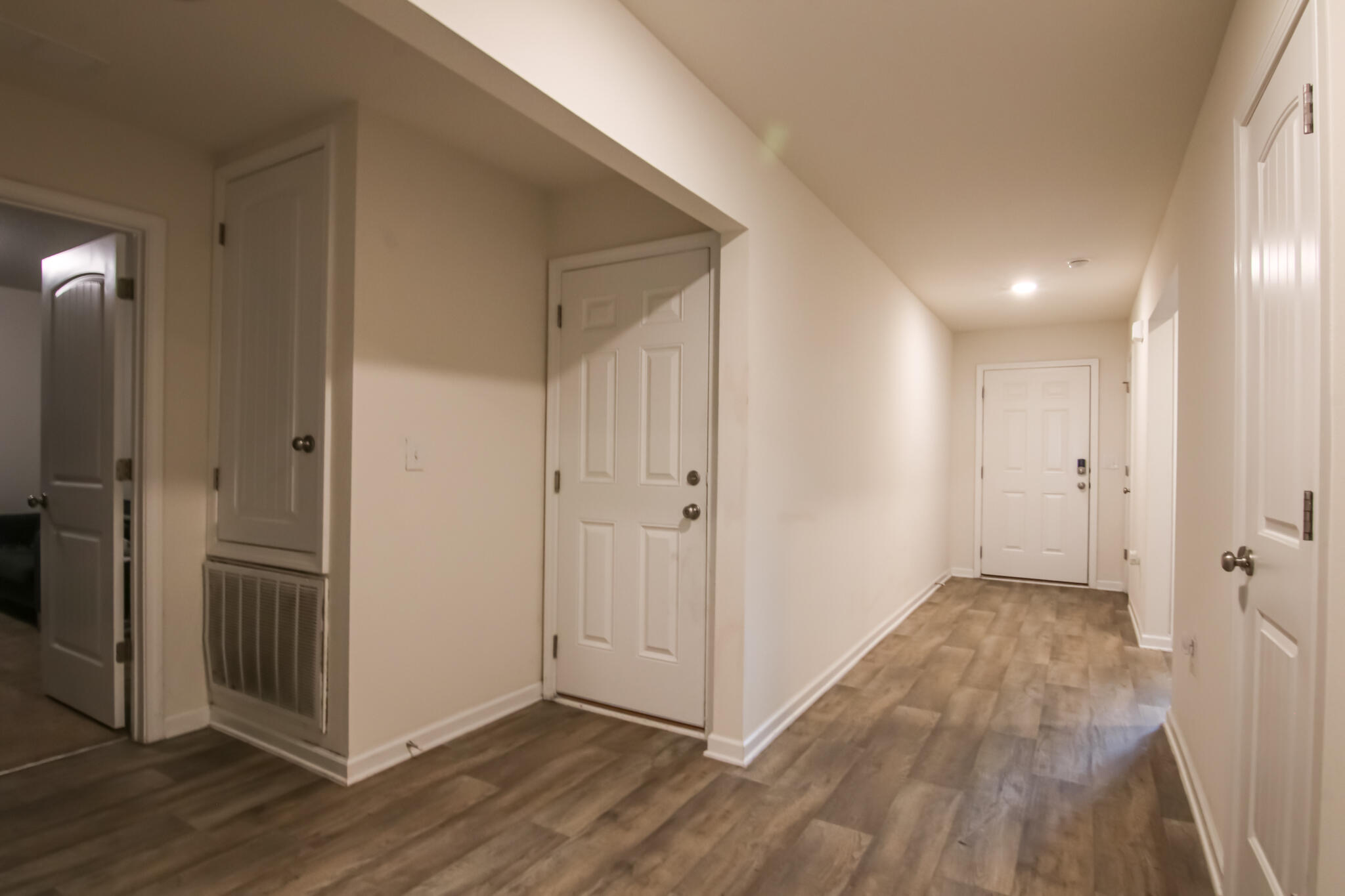 808 Moorhen Way Crestview, FL 32539 - Photo 5 of 47 a view of hallway with wooden floor