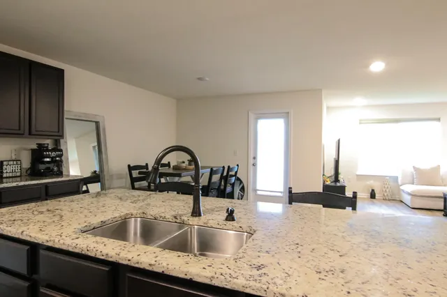 a kitchen with a refrigerator stove and microwave