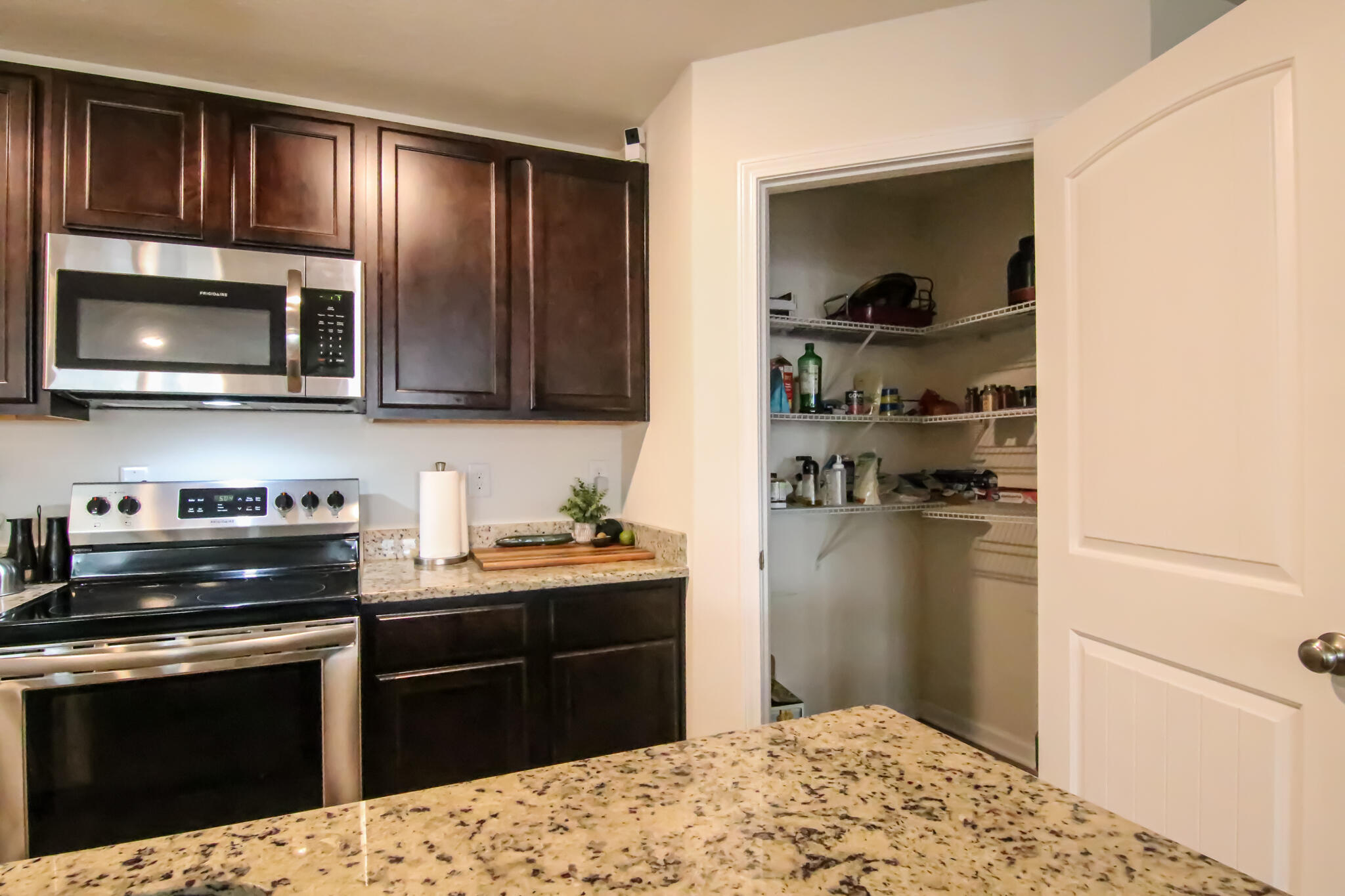 808 Moorhen Way Crestview, FL 32539 - Photo 9 of 47 a kitchen with a refrigerator stove and microwave