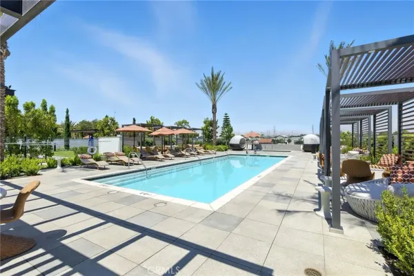 a view of swimming pool with outdoor seating and a terrace