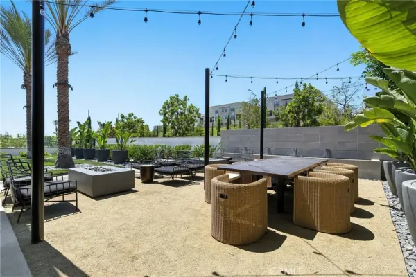 a view of swimming pool with outdoor seating and plants