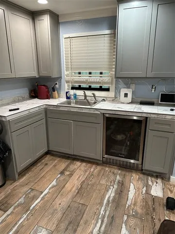 a kitchen with sink cabinets and window