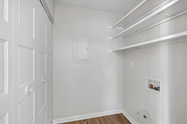 a bathroom with a sink toilet a large mirror and window