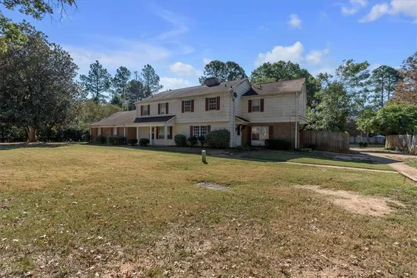 a front view of a house with a yard