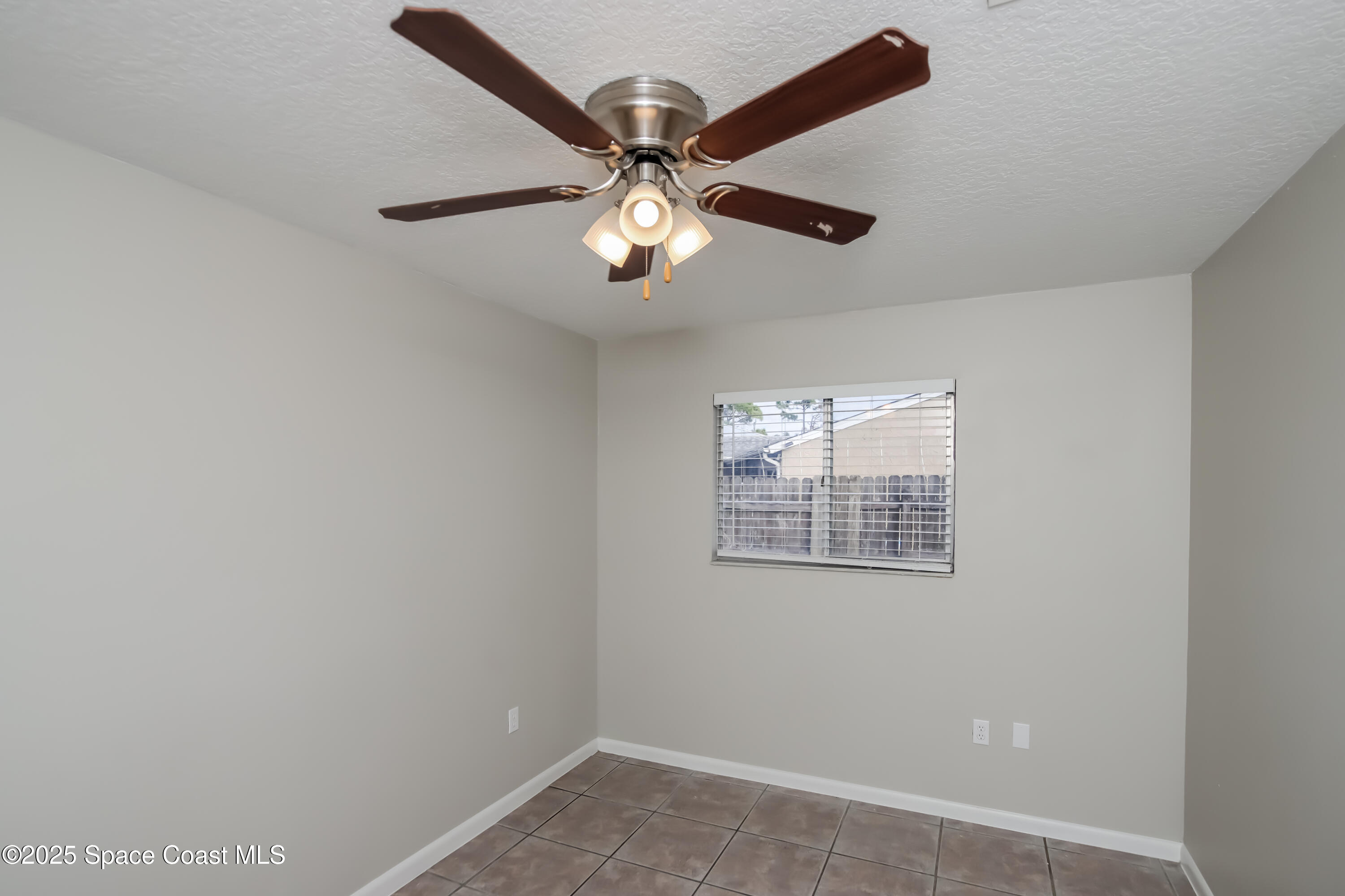 1130 Emerald Road Southeast Palm Bay, FL 32909 - Photo 10 of 16 a view of an empty room with a window