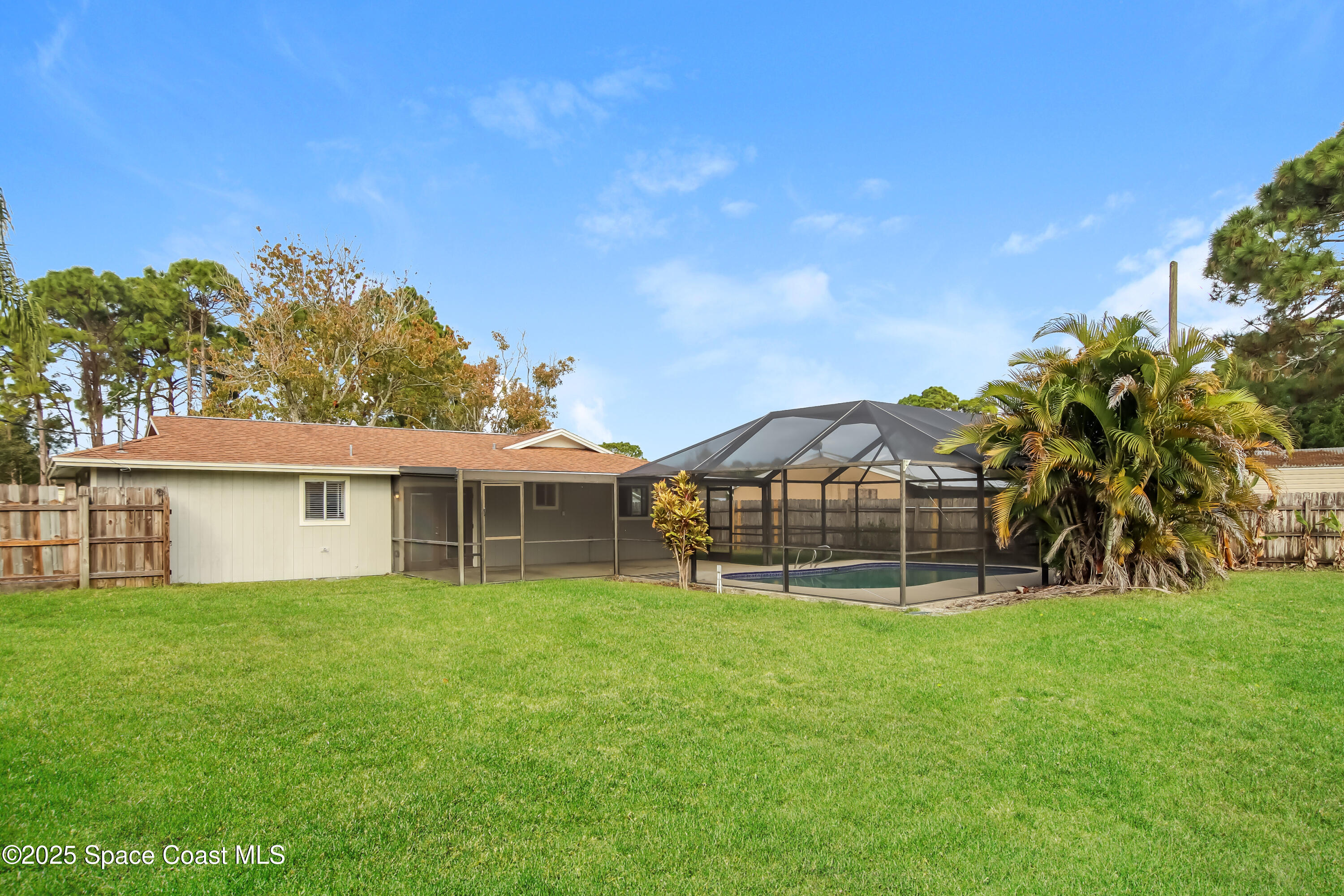 1130 Emerald Road Southeast Palm Bay, FL 32909 - Photo 15 of 16 a view of a house with a yard and sitting area