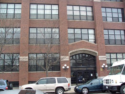 17 North Loomis Street, Unit 2K Chicago, IL 60607 - Photo 1 of 1 a front view of a building with parking space