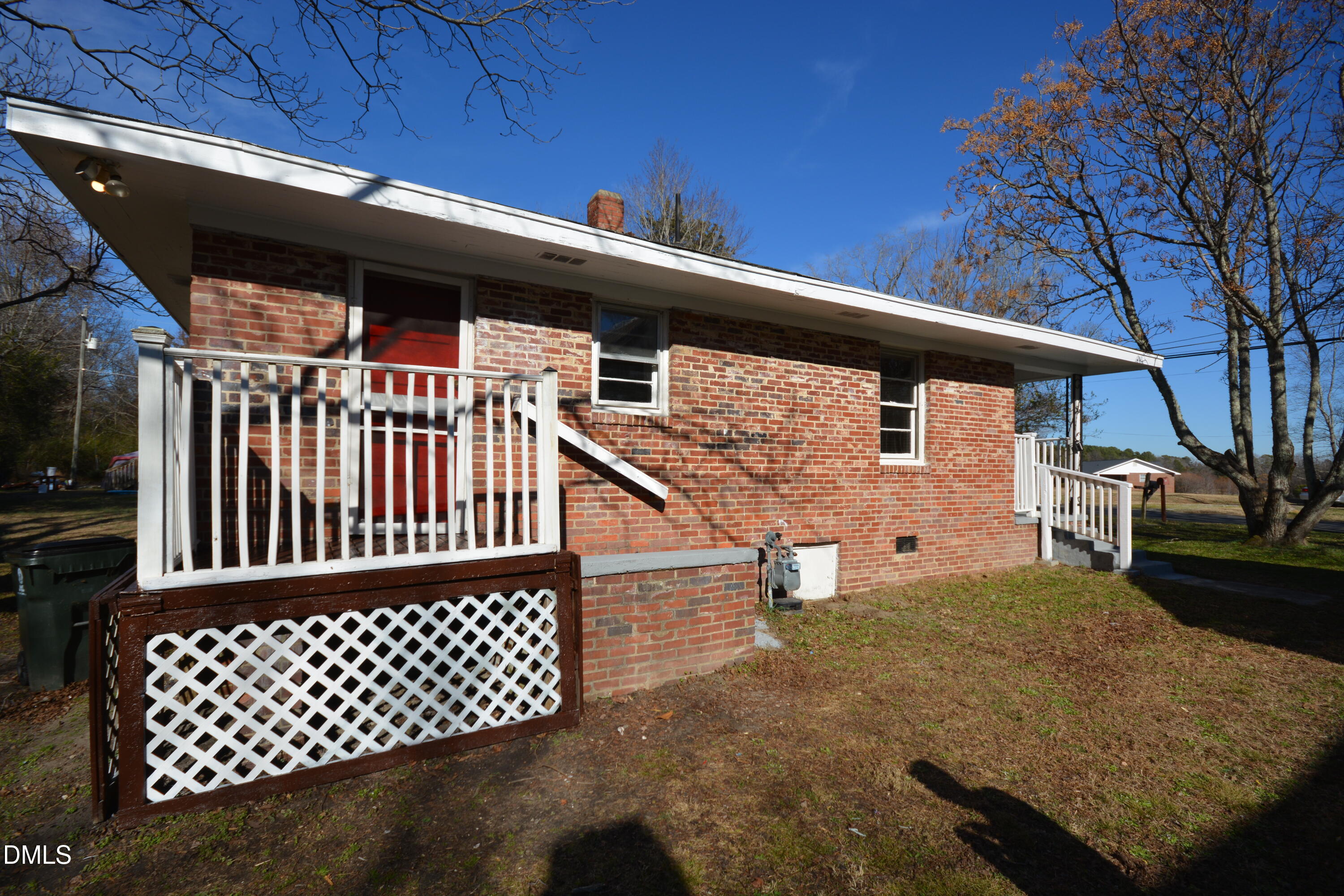 1324 Raleigh Road Oxford, NC 27565 - Photo 15 of 18 a view of a porch with wooden floor and fence
