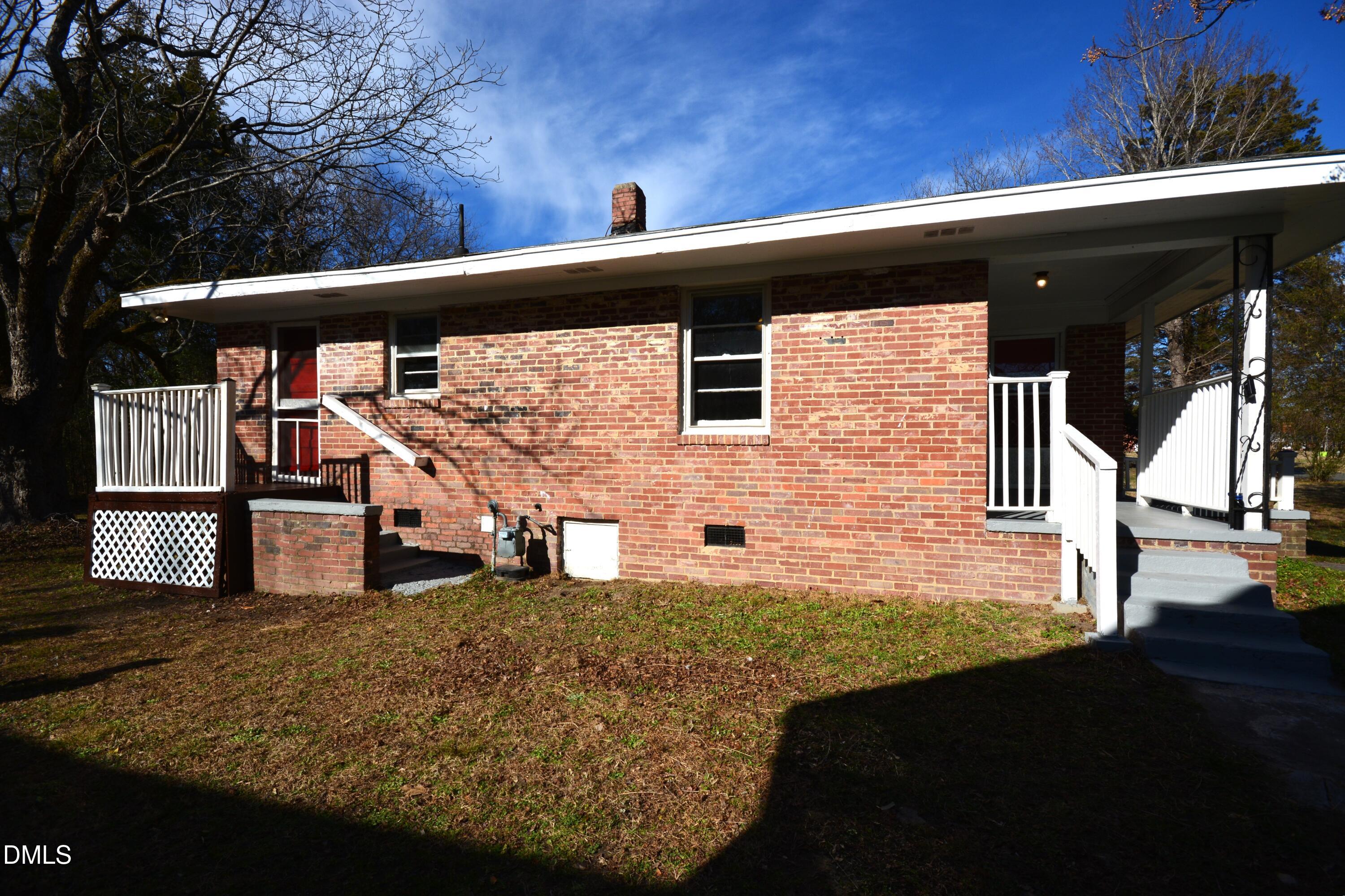 1324 Raleigh Road Oxford, NC 27565 - Photo 16 of 18 a view of house with backyard and deck