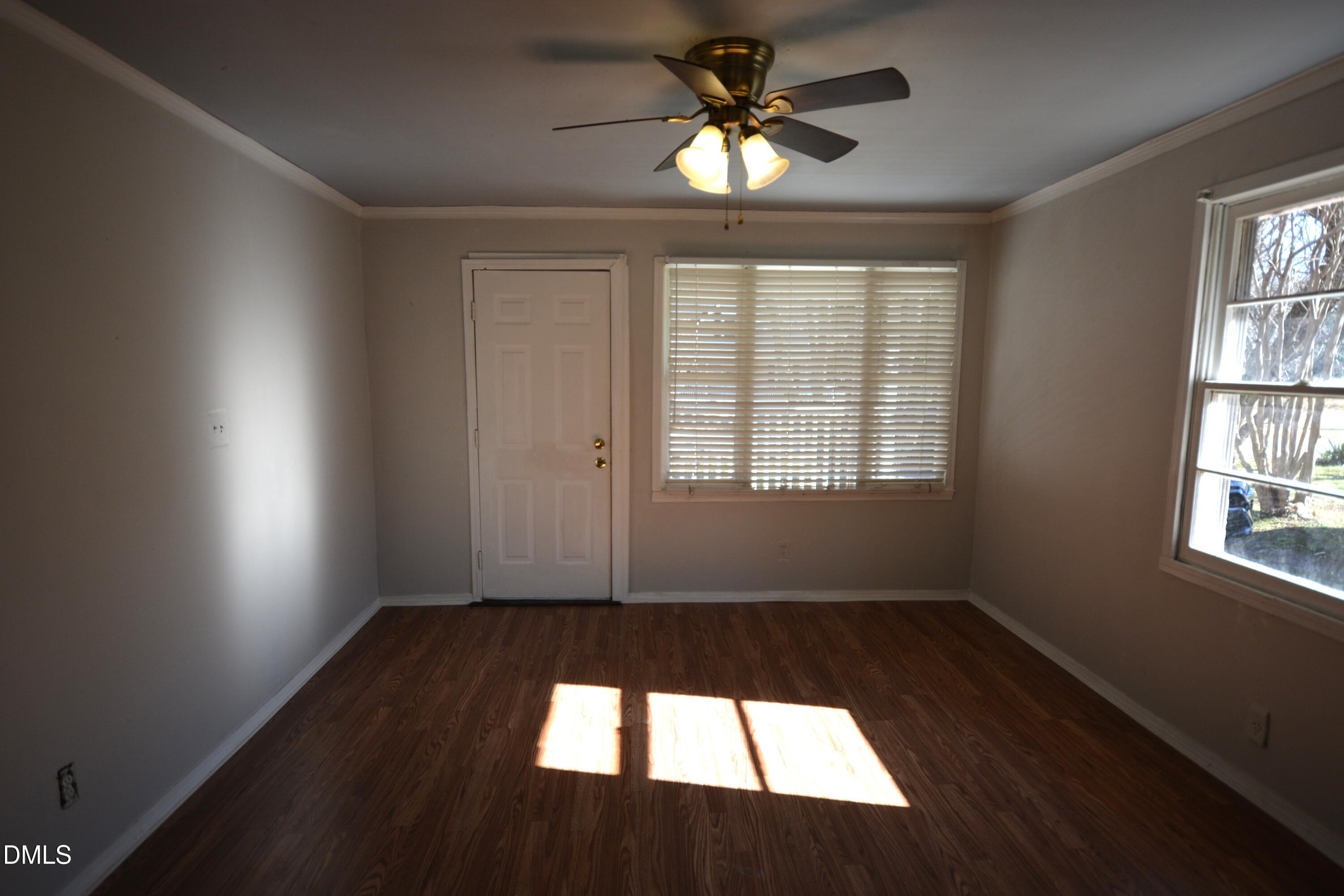 1324 Raleigh Road Oxford, NC 27565 - Photo 3 of 18 wooden floor in an empty room with a window