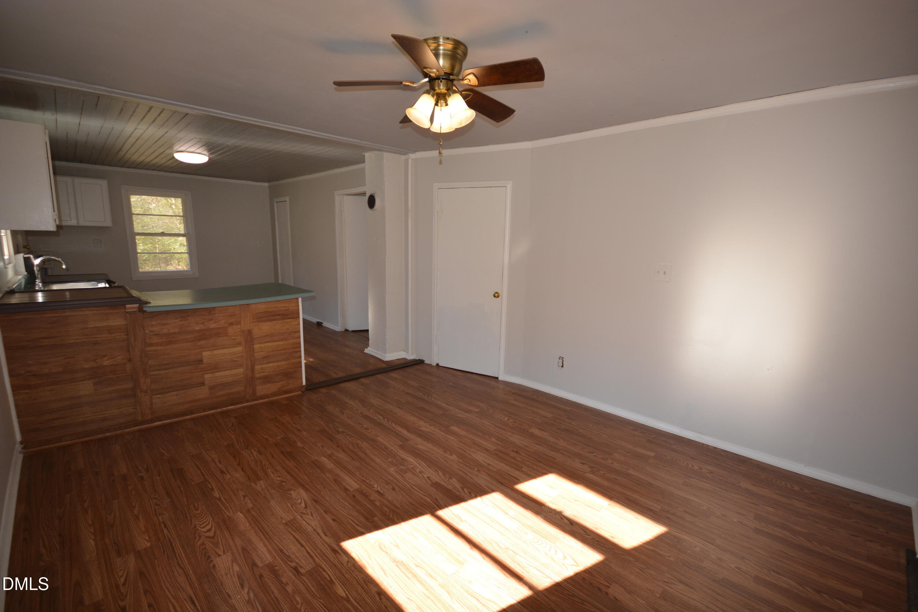 1324 Raleigh Road Oxford, NC 27565 - Photo 4 of 18 a view of a room with wooden floor and a ceiling fan