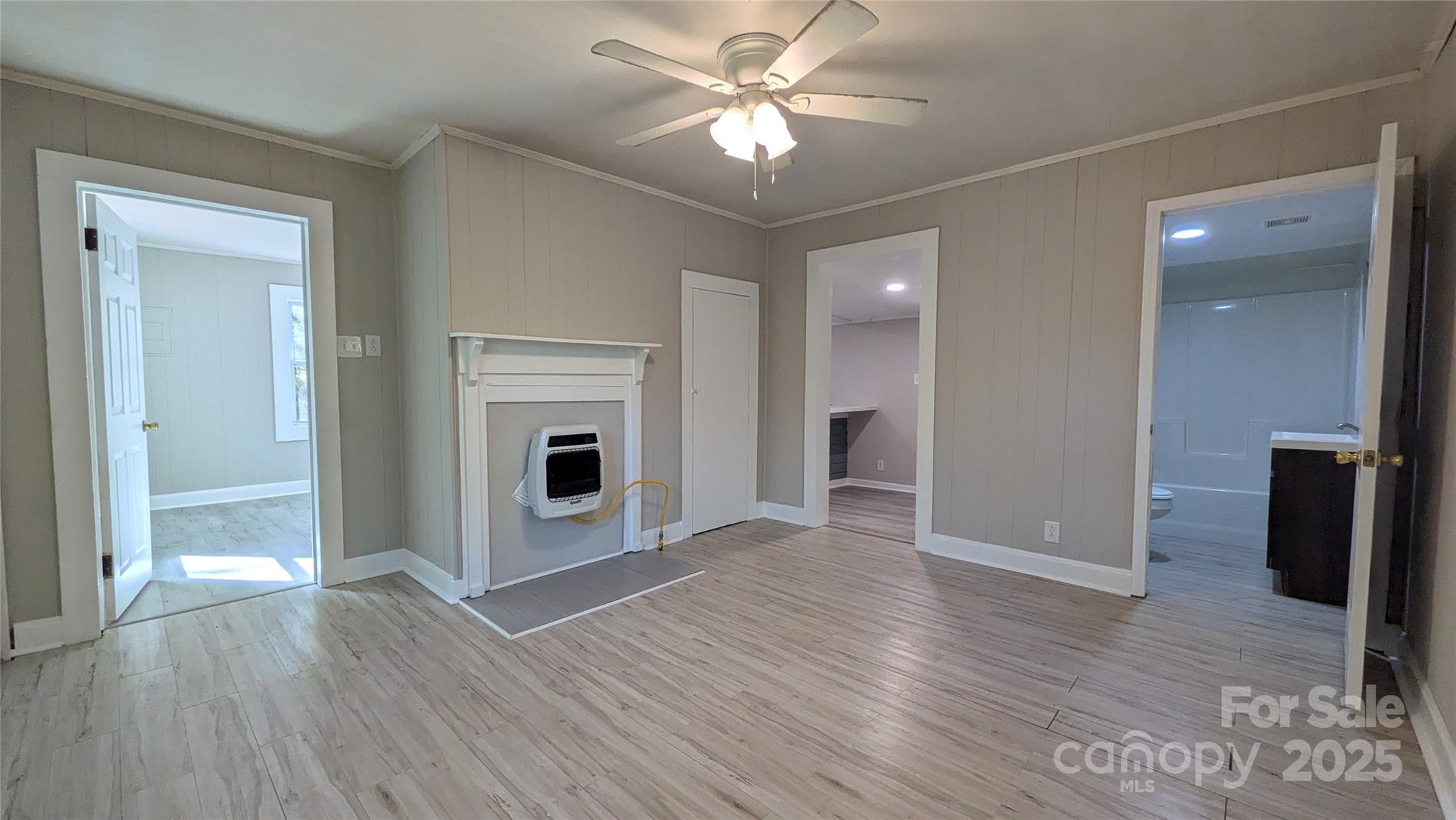 110 Dye Street Chester, SC 29706 - Photo 11 of 22 an empty room with wooden floor and a ceiling fan
