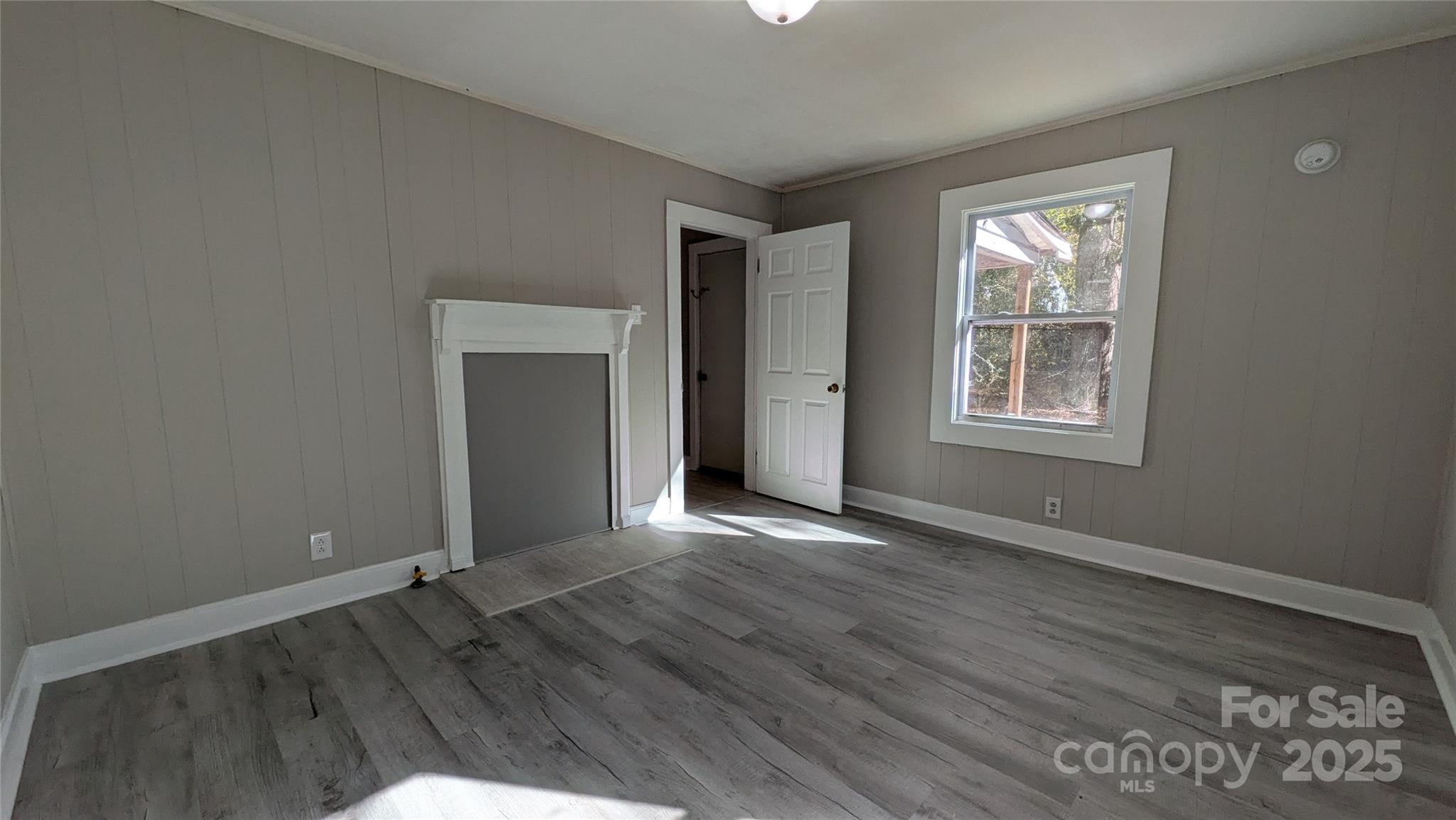 110 Dye Street Chester, SC 29706 - Photo 17 of 22 an empty room with wooden floor and windows