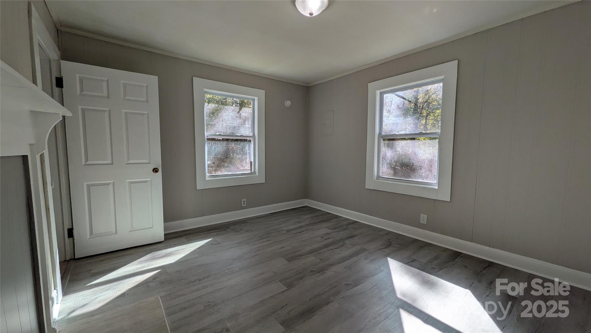 110 Dye Street Chester, SC 29706 - Photo 18 of 22 a view of an empty room with wooden floor and a window