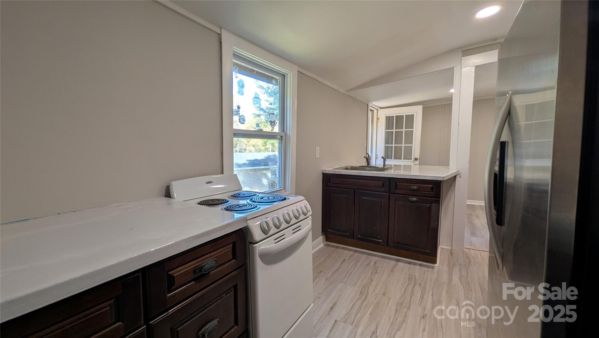 110 Dye Street Chester, SC 29706 - Photo 8 of 22 a kitchen with a sink and a stove top oven