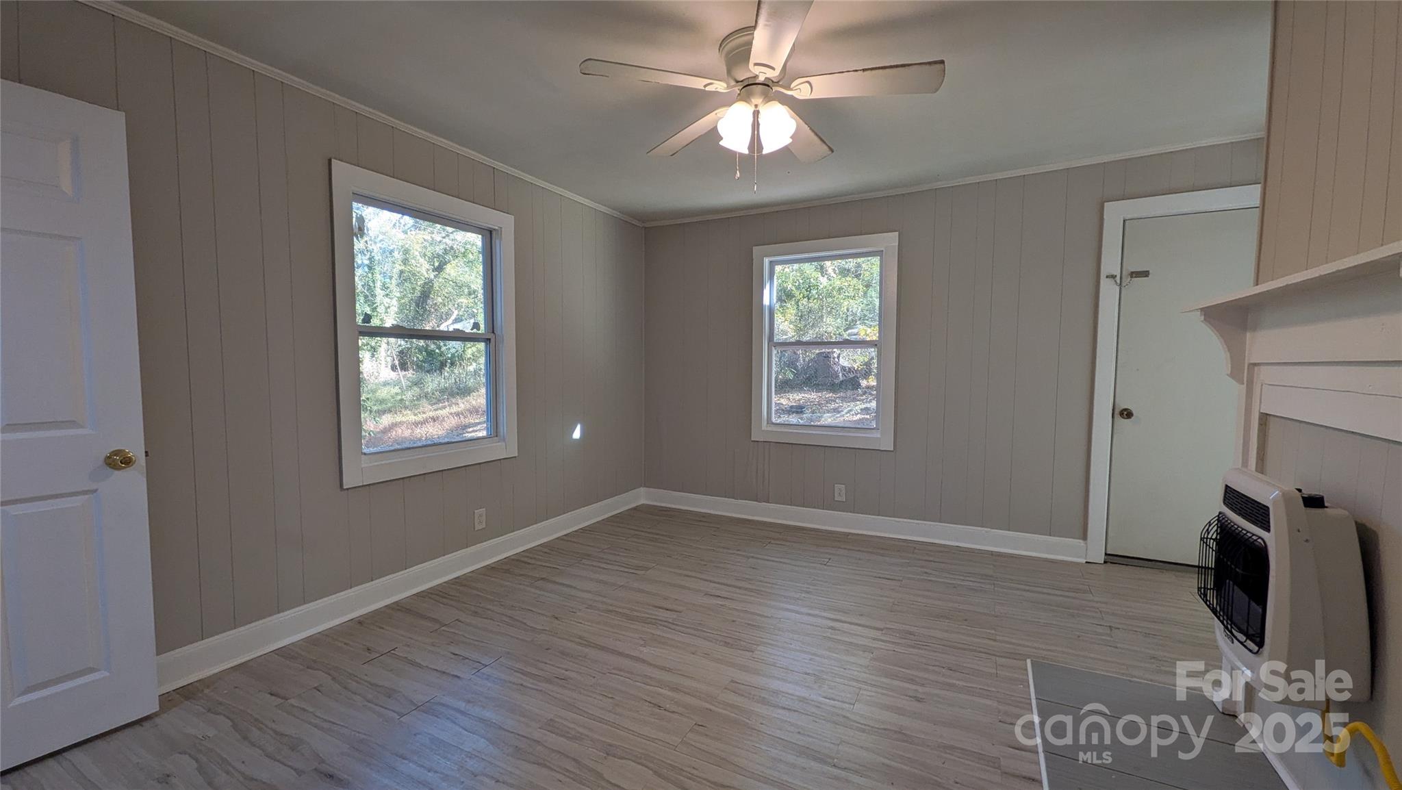 110 Dye Street Chester, SC 29706 - Photo 10 of 22 wooden floor in an empty room with a window